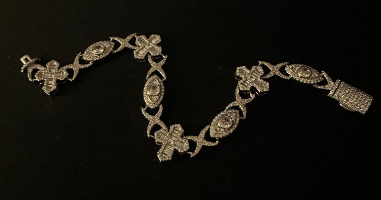 Silver crystal link bracelet, photographed on its original surface